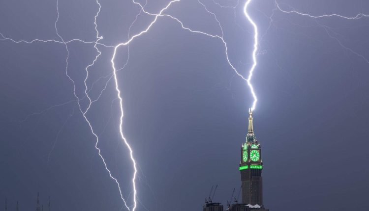Powerful lightning strikes the Clock Tower in Mecca